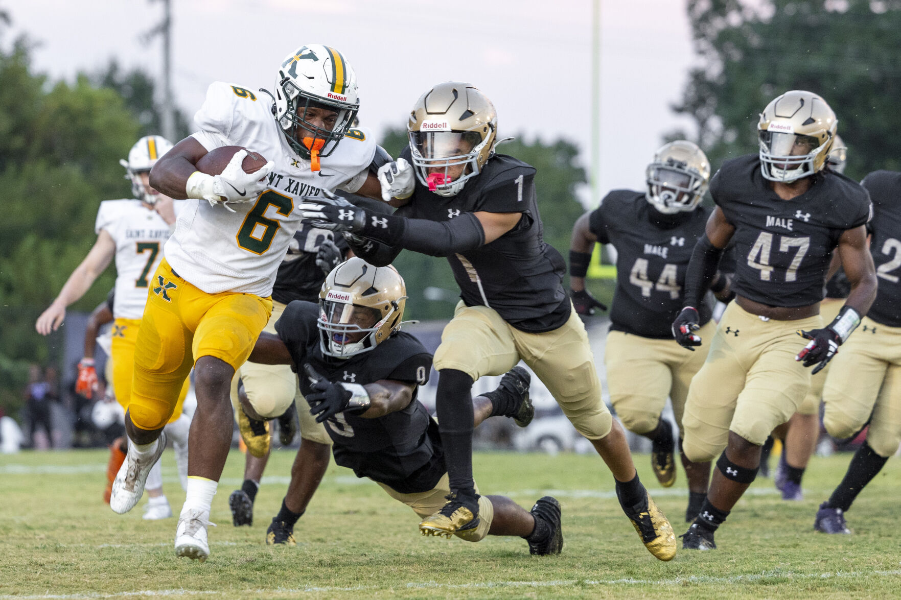 IMAGES | Male beats St. X 35-34 in overtime